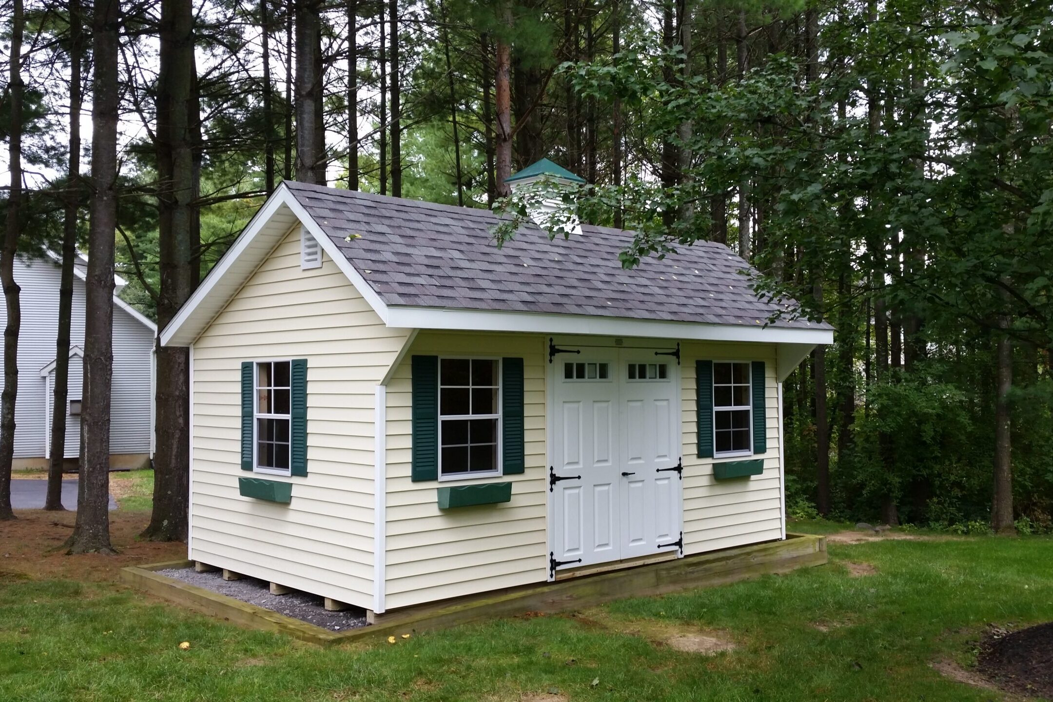 A charming white Quaker-style shed