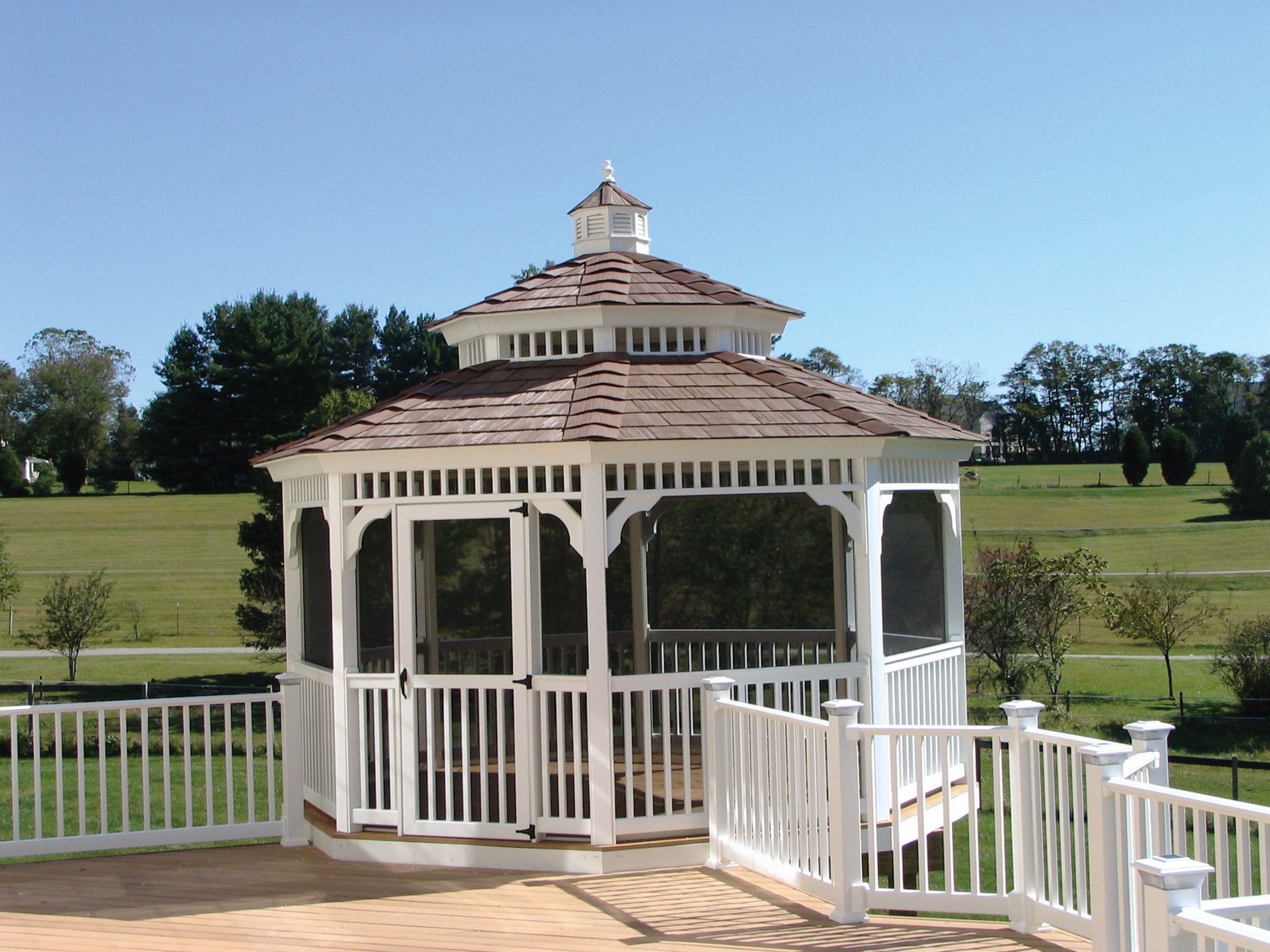 A small gazebo built onto a wooden deck