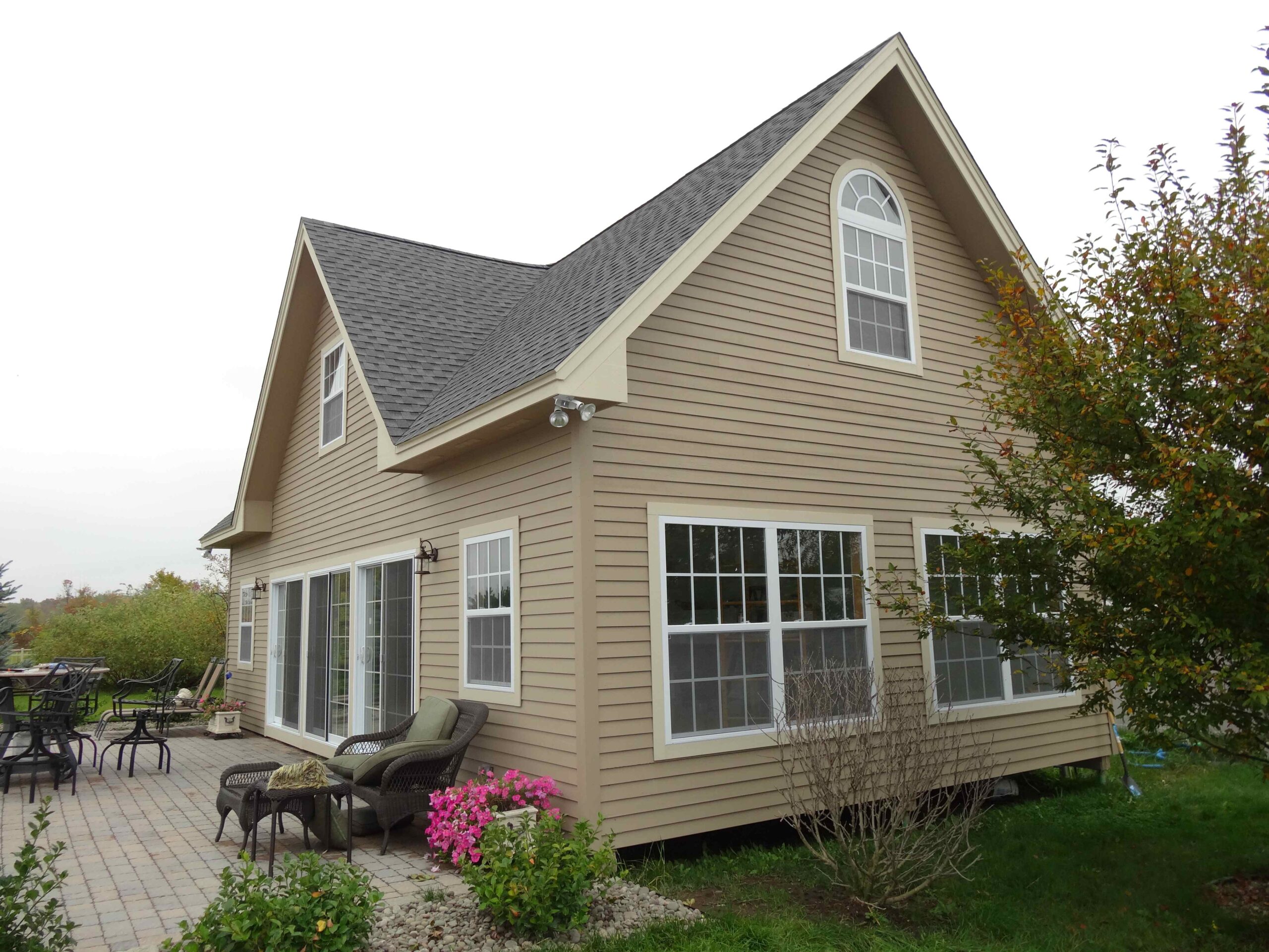 A large custom combination pool house and guest house.